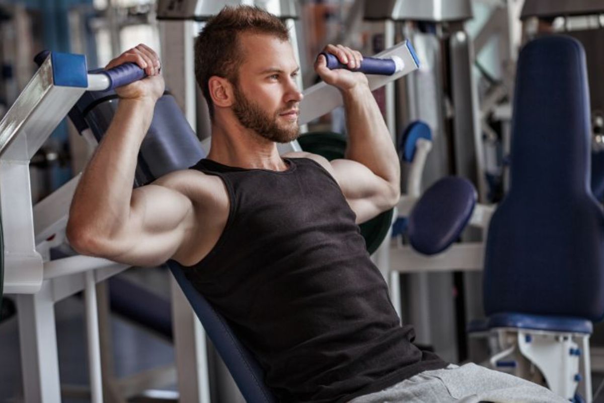 NPL-whey-protein-man-on-exercise-machine-min